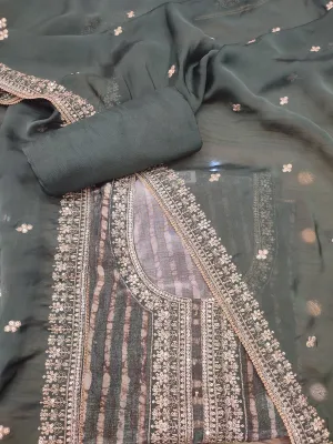 Dark green crape silk semistich suit without sleeves with zari embroidery