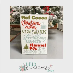 “Hot cocoa, Christmas movies, warm sweaters” Christmas sign